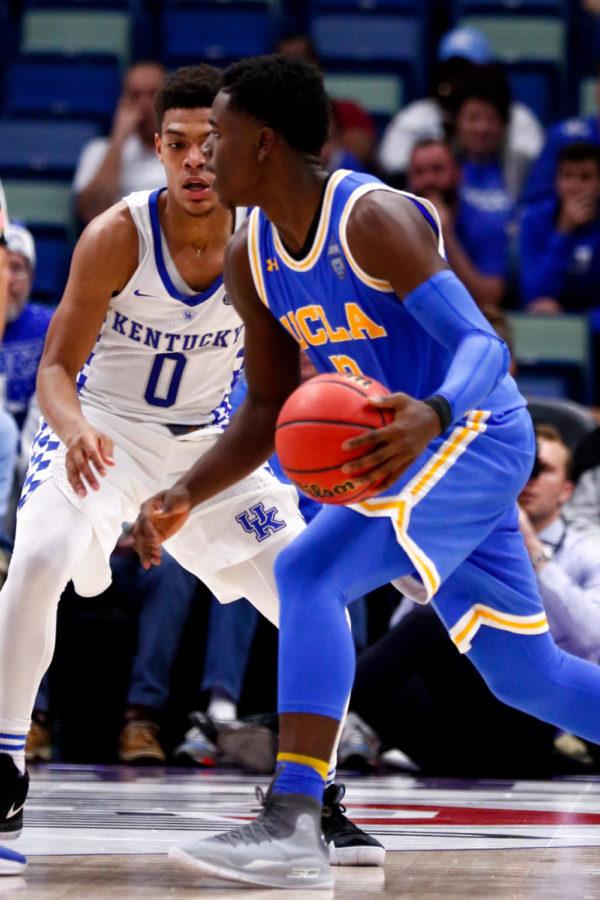 Kentucky freshman guard Quade Green guards UCLA junior guard Aaron Holiday during the CBS Sports Classic game on Saturday, December 23, 2017 in New Orleans, Louisiana. Kentucky was defeated 83-75. Photo by Arden Barnes | Staff