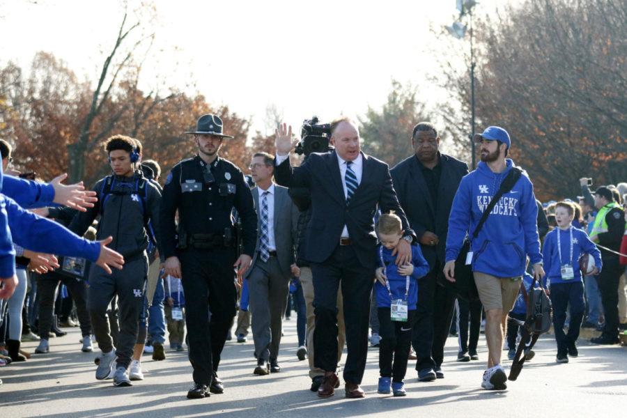 UK Head coach Mark Stoops waves to fans during the Catwalk prior to the senior day game against Louisville on Saturday, November 25, 2017 in Lexington, Ky. Louisville won the game 44-17.