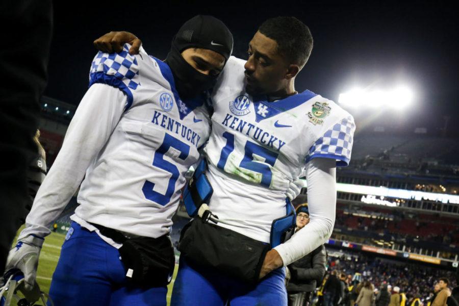 Kentucky Wildcats quarterback Stephen Johnson consoles Kentucky Wildcats cornerback Kendall Randolph after losing to the Northwestern Wildcats during the Music City Bowl on Friday, December 29, 2017 in Nashville, Tennessee. Kentucky was defeated 24-23. Photo by Arden Barnes | Staff