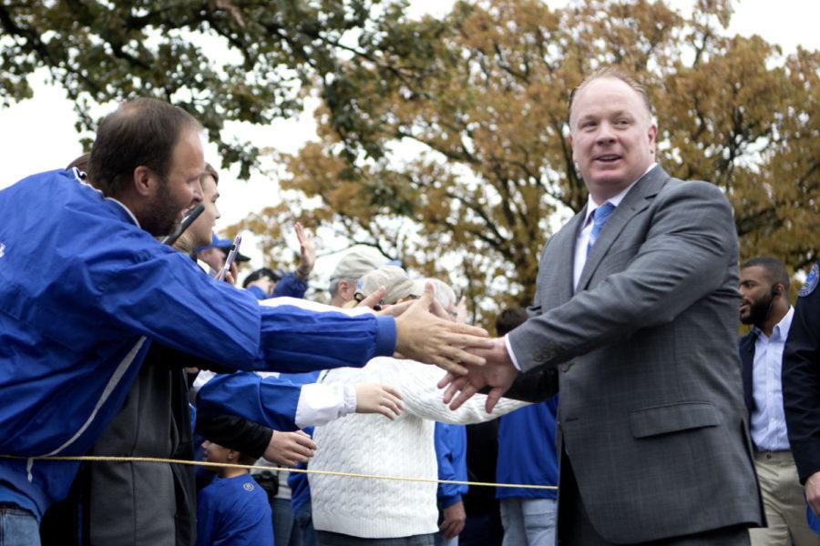 Kentucky head coach Mark Stoops shakes hands with fans during the Cat Walk before the game against Ole Miss on Saturday, November 4, 2017 in Lexington, Ky. Kentucky lost the game 37-34. Photo by Carter Gossett | Staff