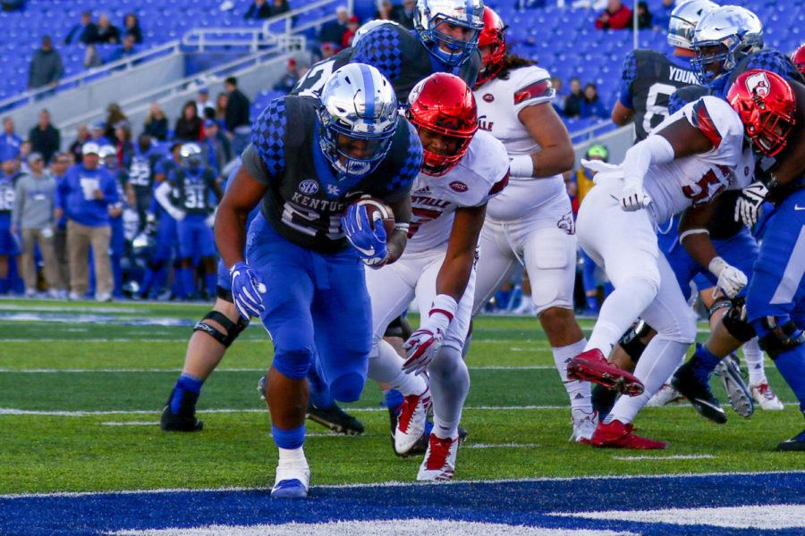Kentucky Wildcats running back Benny Snell Jr. (26) scores a touchdown during the Governors Cup game against Louisville at Kroger Field on Saturday, November 25, 2017 in Lexington, Kentucky. Louisville won 44-17. Photo by Arden Barnes | Staff