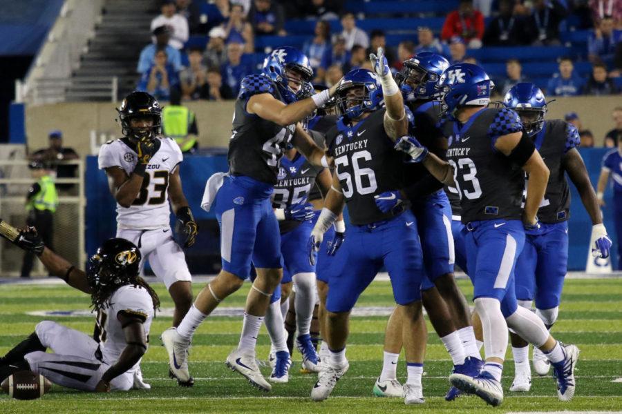 Kentucky linebacker Kash Daniel celebrates with his team after converting on a fake punt during the game against Missouri Saturday, October 7, 2017 in Lexington, Ky. Kentucky won the game 40-34.