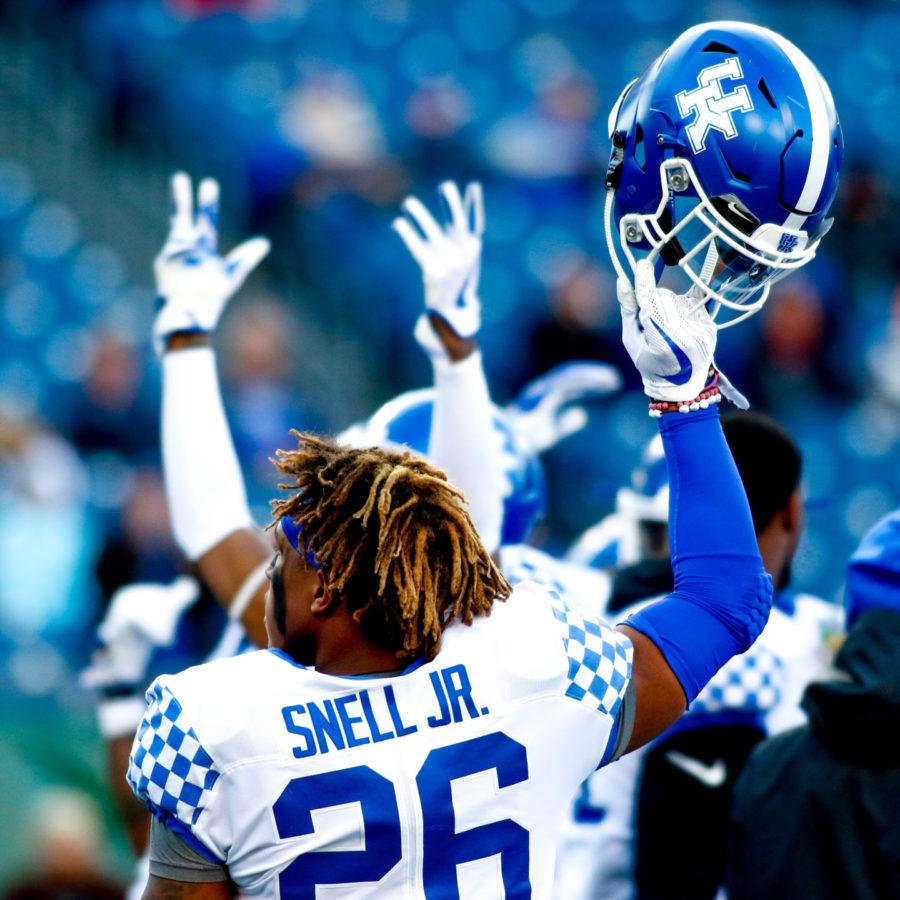 Kentucky Wildcats running back Benny Snell Jr. lifts his helmet to the crowd prior to the Music City Bowl game against Northwestern on Friday, December 29, 2017 in Nashville, Tennessee. Kentucky was defeated 24-23. Photo by Arden Barnes | Staff