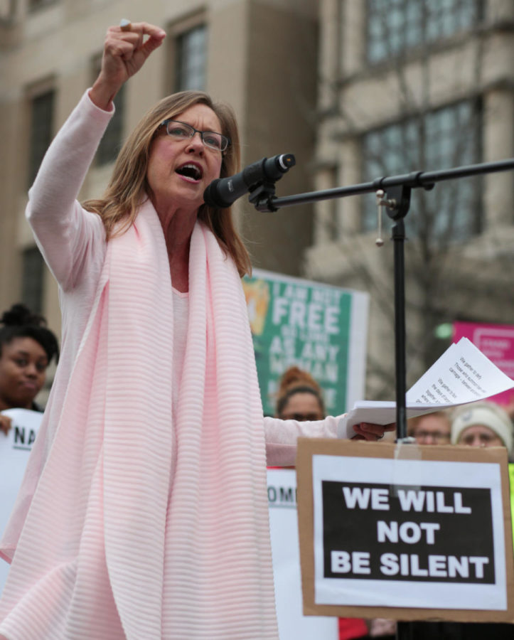 Kentucky state representative Kelly Flood, D-Fayette (District 75), speaks at an event in solidarity with the Womens March on Washington in Lexington, Ky., on Saturday, January 21, 2017. Thousands of people gathered in front of Fayette Countys district and circuit courts and marched through the city to protest President Donald Trumps inauguration. Photo by Joshua Qualls | Staff