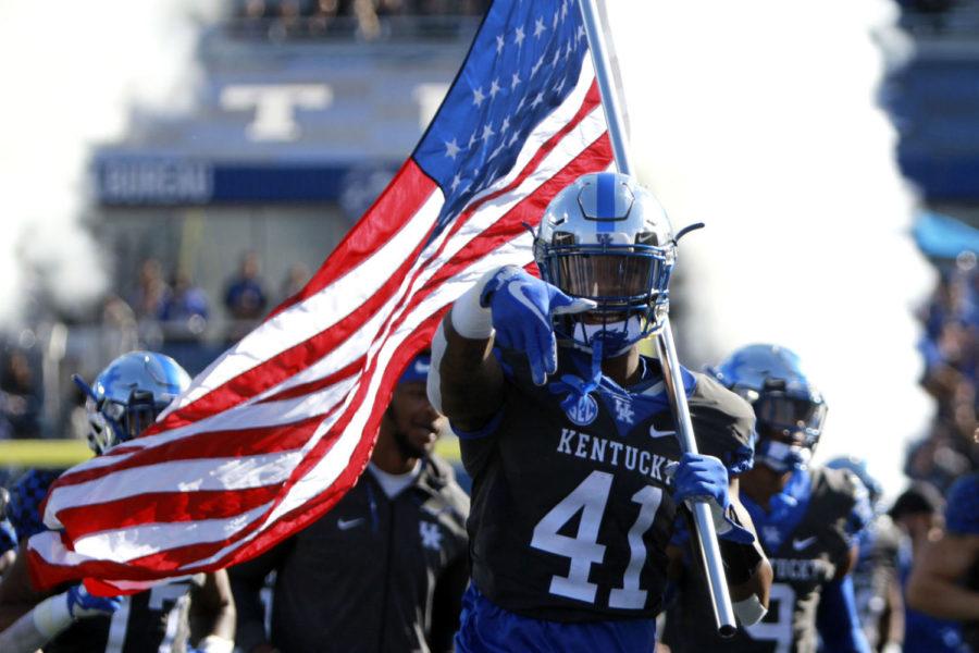 Kentucky Wildcats linebacker Josh Allen (41) runs onto the field pointing his hand with the L down before the game against Louisville on Saturday, November 25, 2017 in Lexington, Ky. Photo by Carter Gossett | Staff