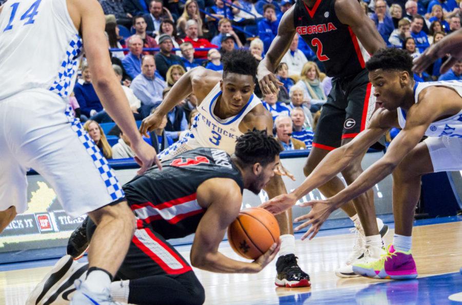 Kentucky fights for the ball during the game against Georgia on Sunday, December 31, 2017 in Lexington, Kentucky. Kentucky won 66 to 61. Photo by Olivia Beach | Staff