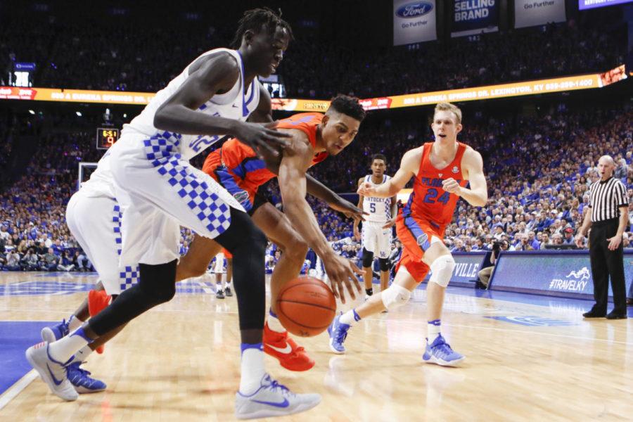 Kentucky Wildcats forward Wenyen Gabriel goes after a loose ball during a game against the Florida Gators on Saturday, February 25, 2017 in Lexington, Ky. Kentucky won the game 76-66. Photo by Carter Gossett | Staff