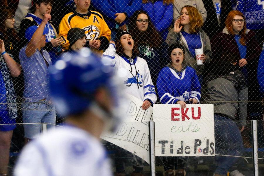 Kentucky fans sport signs during the game against EKU on Saturday, January 20, 2018 in Lexington, Kentucky. The Cats were defeated 6-5. Photo by Arden Barnes | Staff