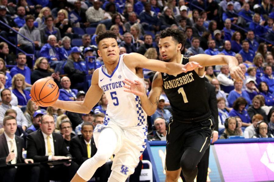Kevin Knox drives against a Vanderbilt defender during the game against Vanderbilt on Tuesday, January 30, 2018 in Lexington, Ky. Kentucky won in overtime 83-81 | Photo by Chase Phillips | Staff