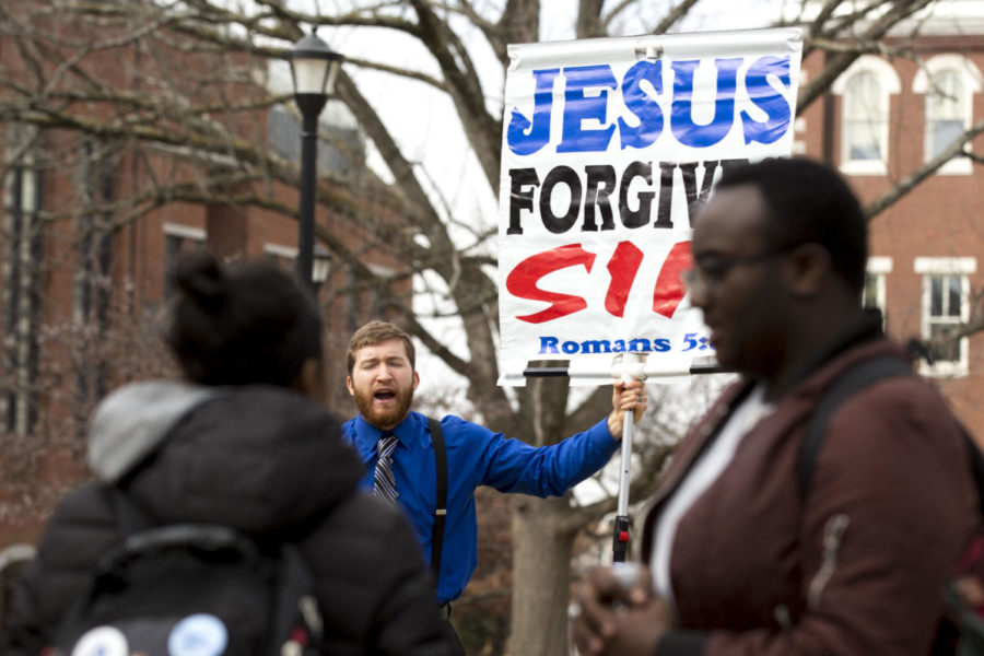 UK students interacted with Zachary Humphrey, a preacher from Public Proclaimer Ministries, outside Whitehall on UKs campus on Tuesday, February 13, 2018 in Lexington, Ky. Photo by Arden Barnes | Staff
