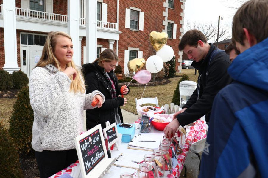 Alpha Phi members sell coffee, hot chocolate and donuts outside their house on Monday, Feb. 12, 2018. Photo by Rick Childress