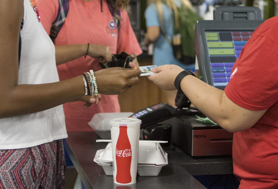 A student uses their wildcard ID to purchase food at Bowmans Den on September 14, 2016 in Lexington, Ky.