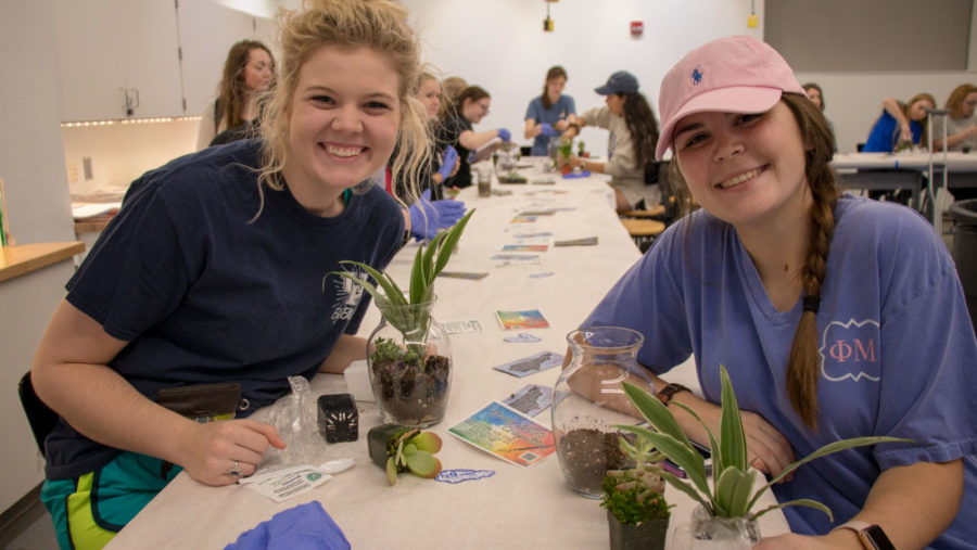 Sophomores+Kaitlyn+Grant+%28left%29+and+Allie+Forshee+are+excited+about+creating+their+terrariums+on+Tuesday%2C+February+20%2C+2018+in+Lexington%2C+Ky.+The+Terrarium+workshop+has+been+a+popular+activity+since+it+began+last+semester.+Photo+By+Genna+Melendez+%7C+Staff