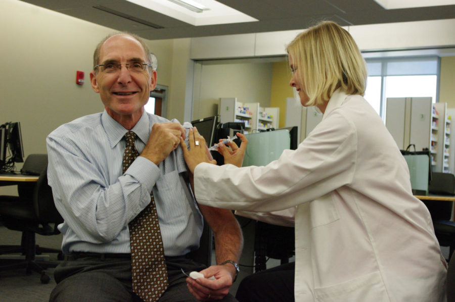 University of Kentucky President Dr. Eli Capilouto received his flu shots from UK pharmacy student Leanne Hewlett in the UK pharmacy building on Oct 6, 2011. Photo by Collin Lindstrom | Staff