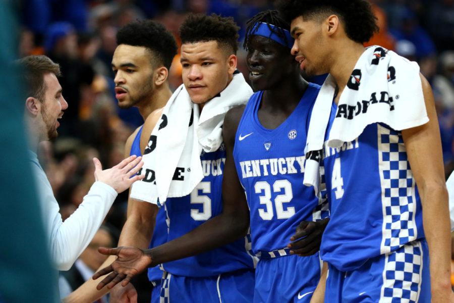 Kentucky team members congratulate each other after a good play during the game against Tennessee in the SEC tournament championship on Sunday, March 11, 2018, in St. Louis, Missouri. Photo by Arden Barnes | Staff