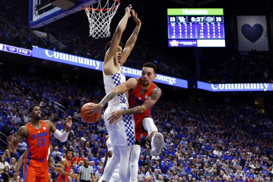 #11 Chris Chiozza of the Florida Gators tries passing the ball around the back of Sacha Killeya-Jones #1 of the Kentucky Wildcats during the game against Florida Saturday, January 20, 2018 in Lexington, Ky. Florida defeated Kentucky 66-64. Photo by Carter Gossett | Staff