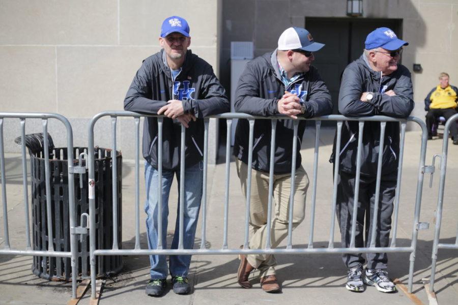 Three UK fans watch the UK vs. Alabama game outside the Scottrade Center in St. Louis, Missouri, on Saturday, March 10. The Cats beat the Crimson Tide 86-63. Photo by Bailey Vandiver | Staff