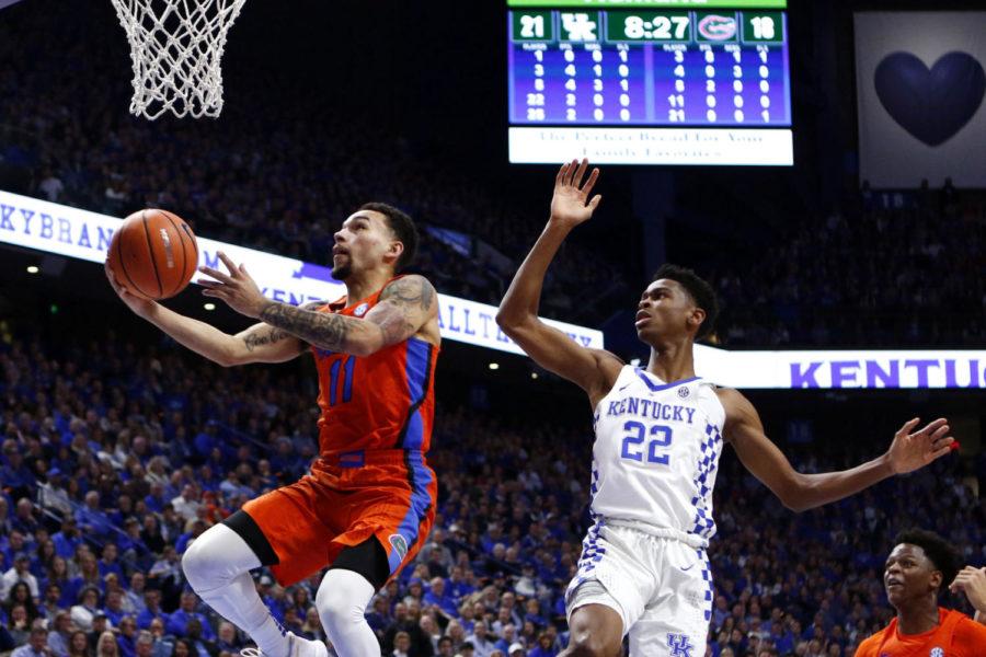 Shai Gilgeous-Alexander #22 of the Kentucky Wildcats lets #11 Chris Chiozza of the Florida Gators by him during the game against Florida Saturday, January 20, 2018 in Lexington, Ky. Florida defeated Kentucky 66-64. Photo by Carter Gossett | Staff