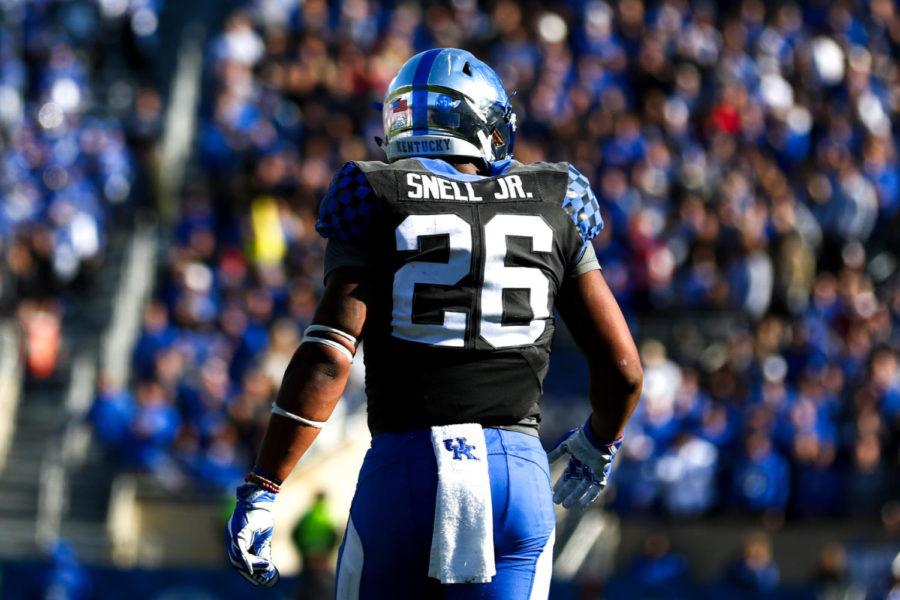 Kentucky Wildcats running back Benny Snell Jr. (26) walks off after a play during the Governors Cup game against Louisville at Kroger Field on Saturday, November 25, 2017 in Lexington, Kentucky. Photo by Arden Barnes | Staff
