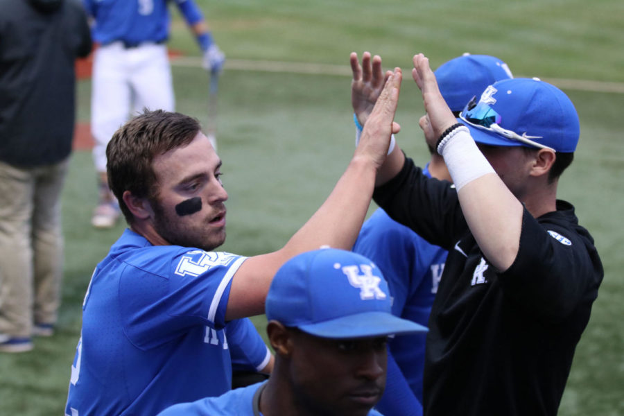 Junior Ben Aklinski high fives teammates after scoring during the game against Miami-Ohio on Tuesday, March 27, 2018 in Lexington, Ky. Photo by Chase Phillips | Staff