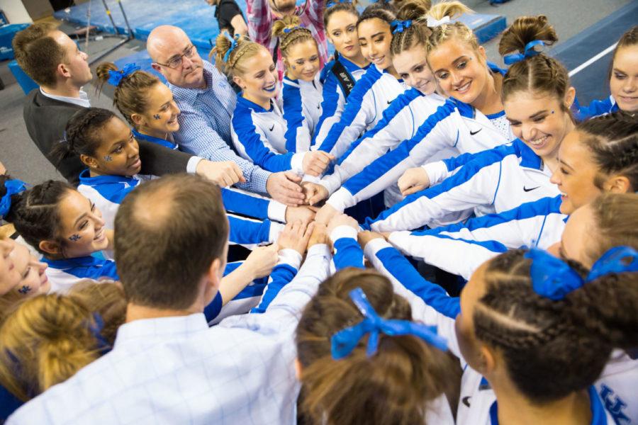 The Kentucky Gymnastics team huddles up after winning the final home meet of the season against Ohio State on Friday, March 2, 2018 in Lexington, Ky. Photo by Jordan Prather | Staff