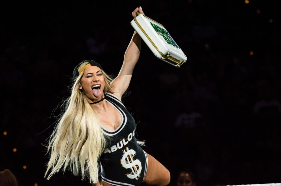 WWE Superstar Carmella shows her Money in the Bank briefcase to the crowd on Sunday, April 1, 2018 in Lexington, Ky. Photo by Edward Justice | Staff