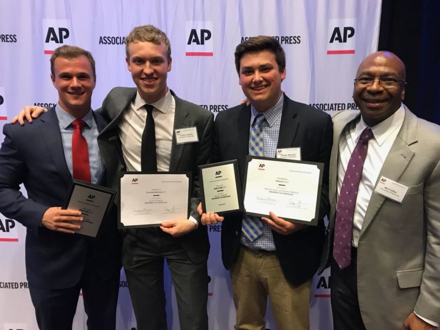 Students Michael Ayers, Curtis Franklin and Hunter Mitchell celebrate their awards at the Kentucky Associated Press Broadcast Journalism Awards alongside professor Mel Coffee. Brady Trapnell, who is studying abroad in London, also placed. Photo provided by Michael Ayers. 