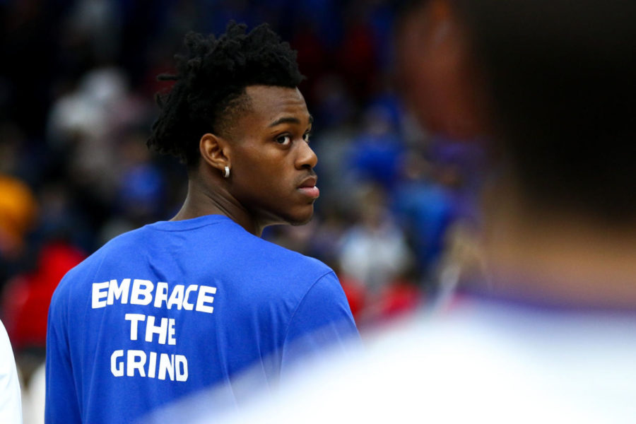 Kentucky freshman forward Jarred Vanderbilt sports watches the Wildcat Marching Band as they play the nation anthem prior to the game against Alabama in the SEC tournament semifinals on Saturday, March 10, 2018, in St. Louis, Missouri. Kentucky defeated Alabama 86-63. Photo by Arden Barnes | Staff