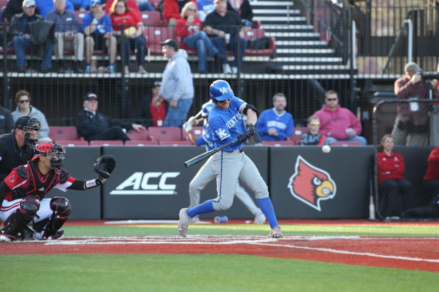 Trey Dawson hits a home run in UKs game at Jim Patterson Stadium against the Louisville Cardinals on April 17, 2018, in Louisville, Kentucky. UK lost the game 8-2. Photo by Barry Westerman
