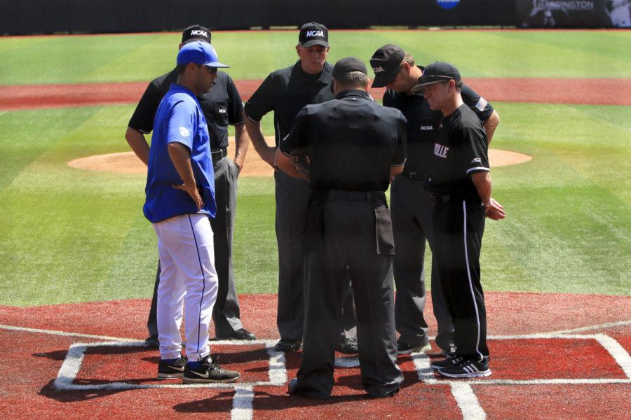 Kentucky Wildcats head coach Nick Mingione and Louisville Cardinal head coach Dan McDonnell meet with the umpires prior to the second game of 2017 NCAA Division I Men's Baseball Super Regional at Jim Patterson Stadium on Saturday, June 10, 2017 in Louisville, KY. Photo by Addison Coffey | Staff.
