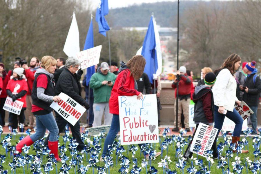 Kentucky educators, students and supporters gathered in Frankfort, Kentucky on Monday, April 2, 2018, to protest the proposed changes in education funding and pensions. Photo by Arden Barnes | Staff