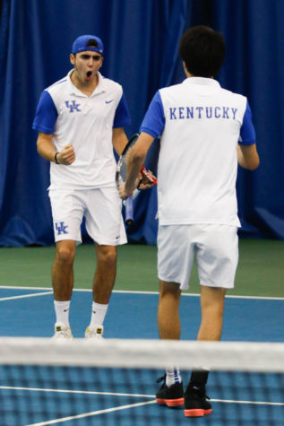 Enzo Wallart celebrates with Ryotaro Matsumura during the match against the Arkansas Razorbacks on Friday, March 4, 2016 in Lexington, Ky. Kentucky won the match 5-2. Photo by Hunter Mitchell | Staff