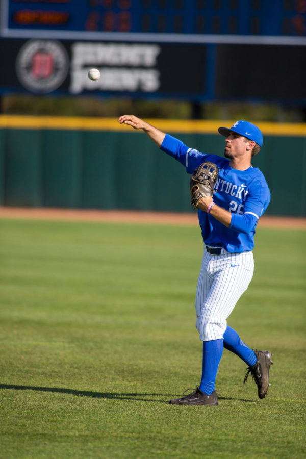 University of Kentucky senior Luke Heyer warms up in the outfield during the game against Louisville on Tuesday, April 3, 2018 in Lexington, Ky. Photo by Jordan Prather | Staff