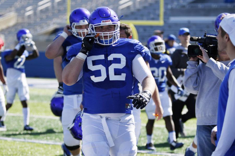 Drake Jackson, center, hustles off of the field during the first open practice at Commonwealth Stadium in Lexington, Ky. on Saturday, March 26, 2016. Photo by Josh Mott | Staff.