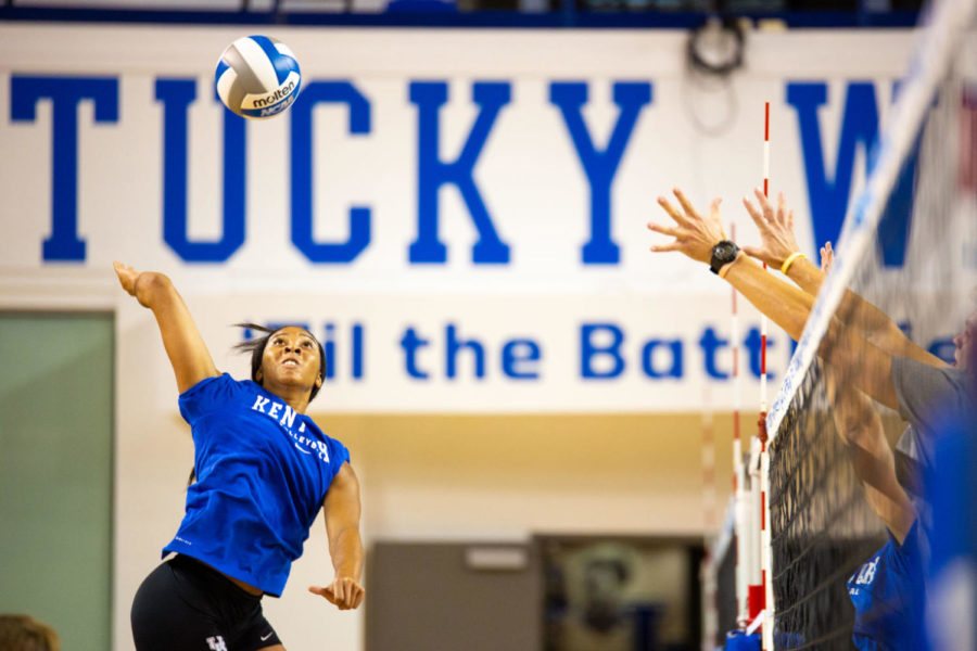 Junior volleyball player Caitlyn Cooper rises above the net during UK Volleyball Media Day on Wednesday, August 15, 2018 in Lexington, Ky. Photo by Jordan Prather | Staff
