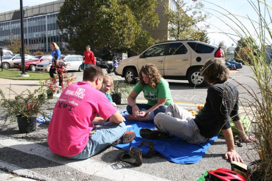 The UK Greenthumb club sits in parking spaces in the E-Lot on Funkhouser Dr. on UKs campus for Park(ing) Day on Oct. 21, 2009. Photo by Adam Wolffbrandt | Staff