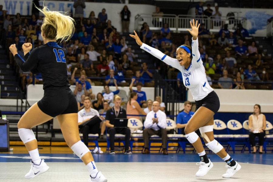 Junior Leah Edmond and sophomore Gabby Curry run to celebrate a point with their teammates during the game against Dayton in the Bluegrass Battle on Friday, August 31, 2018 in Lexington, Ky. Photo by Jordan Prather | Staff