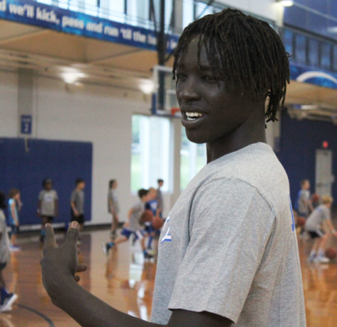 NBA player and former Cat Wenyen Gabriel of the Sacramento Kings laughs as campers at the annual Draft Day camp practice their dribbling at the Johnson Center on August 2nd, 2018.