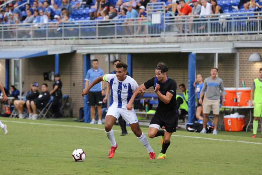 Junior JJ Williams (7) fights for possession. University of Kentucky mens soccer played for their 1st win of the season against DePaul University on Friday, August 24, 2018. Photo by Michael Clubb | Staff
