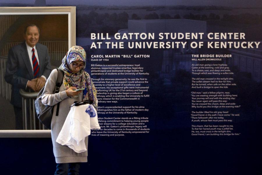 Atiyeh+Sakeni+stands+in+front+of+the+Bill+Gatton+Student+Center+sign+holding+a+free+t-shirt+which+were+given+out+during+a+celebration+honoring+Bill+Gatton+in+the+Student+Center+on+Friday%2C+August+31%2C+2018+in+Lexington%2C+Kentucky.+Photo+by+Arden+Barnes+%7C+Staff