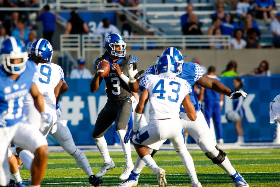 Terry Wilson lines up a pass during Kentucky Football's Blue-White Spring Game on Friday, April 13, 2018 in Lexington, Ky. Photo by Jordan Prather | Staff
