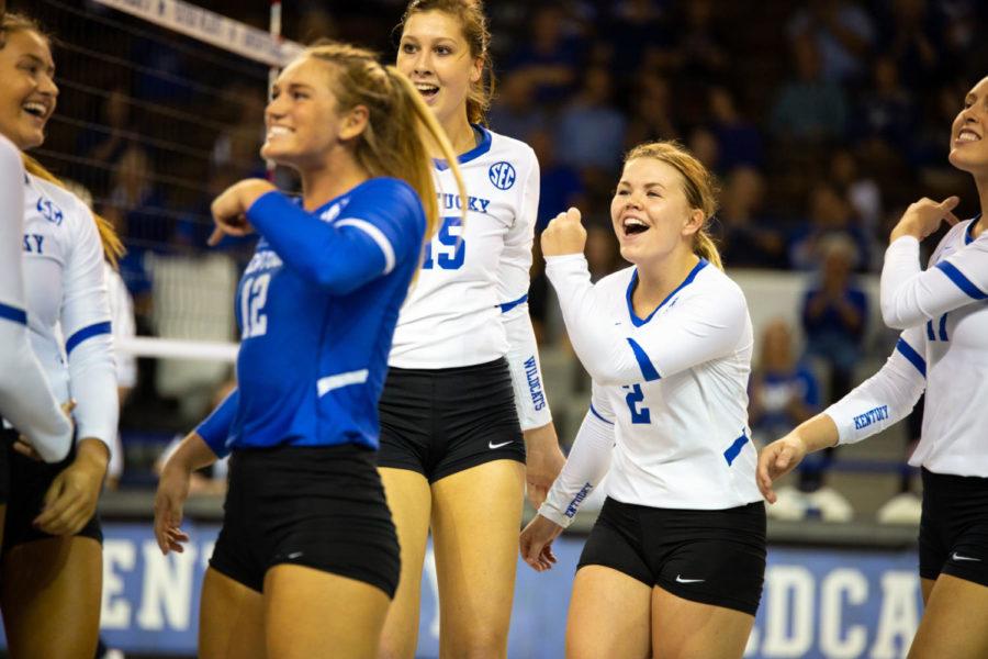 The Kentucky volleyball team celebrates a point during the game against Arkansas on Friday, Sept. 28, 2018 at Memorial Coliseum in Lexington, Ky. Kentucky swept the first three sets to win the match. Photo by Jordan Prather | Staff