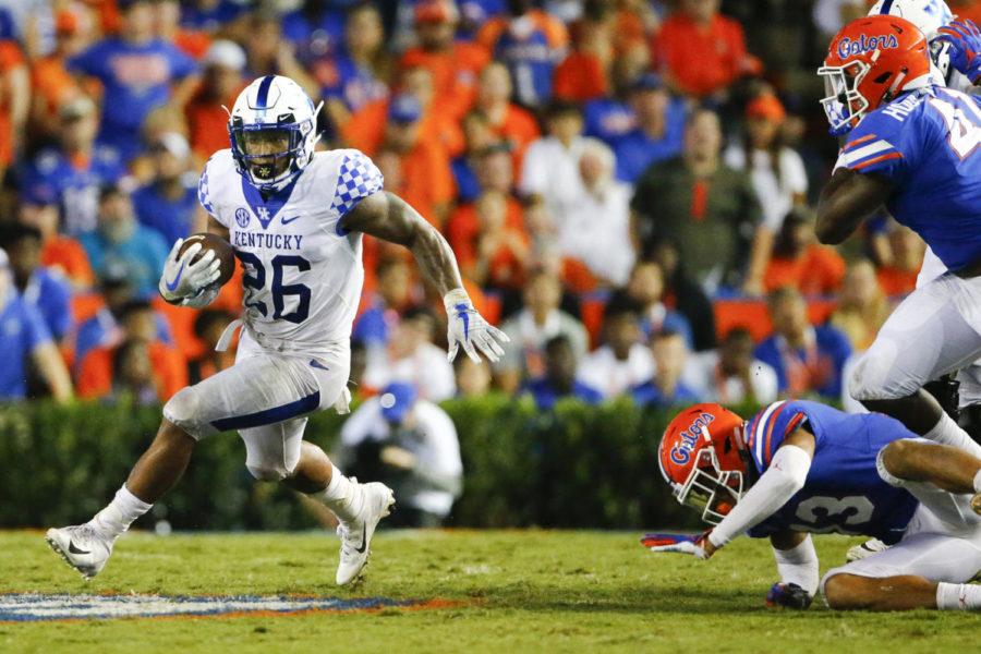 Junior Running Back Benny Snell, Jr. runs past the Gator defense during their game Saturday at Ben Hill Griffin Stadium in Gainesville. Photo provided by Alex Slitz | Lexington Herald-Leader