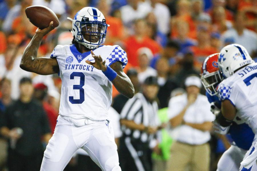 Kentucky Wildcats quarterback Terry Wilson (3) passed the ball over Florida Gators defenders during their game Saturday at Ben Hill Griffin Stadium in Gainesville. Photo provided by Alex Slitz | Lexington Herald-Leader