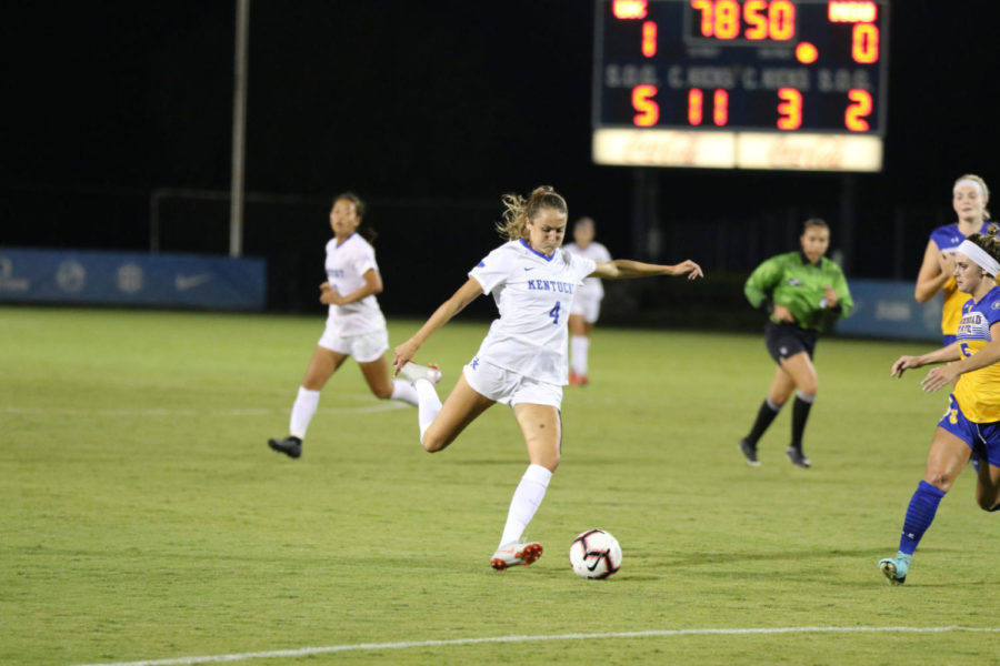 Sophomore+midfielder+Hollie+Olding+lines+up+a+kick+during+the+game+against+Morehead+State+on+August+23rd%2C+2018.+Photo+by+Michael+Clubb+%7C+Staff
