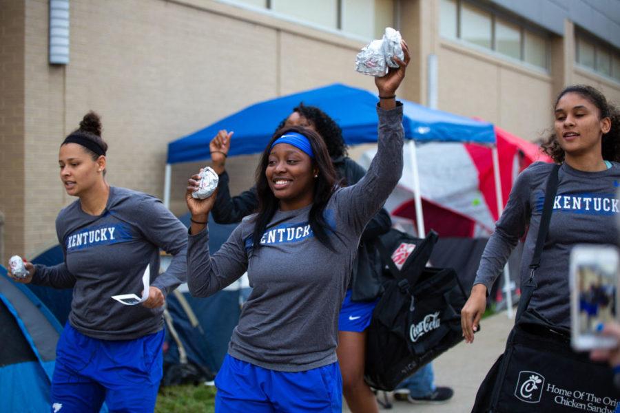 The Kentucky Womens Basketball team pass out breakfast sandwiches to campers outside Memorial Coliseum on Thursday, Sept. 27, 2018, in Lexington, Kentucky. Fans campout in order to have the chance to claim free Big Blue Madness tickets that will be distributed on Friday the 28th. Photo by Jordan Prather | Staff