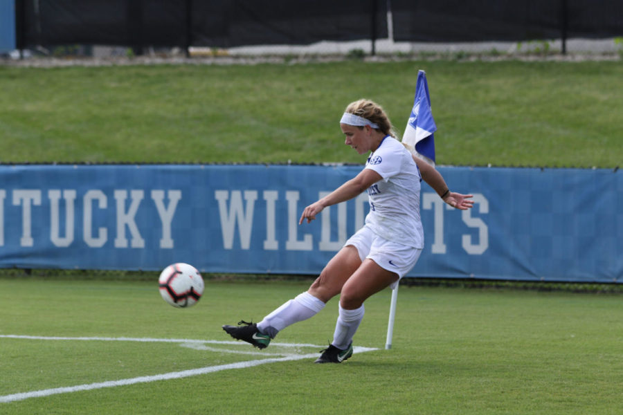 Redshirt Sophomore Marissa Bosco (9) crossing the ball in from a corner kick. University of Kentucky women's soccer received their first loss of the season against University of Wisconsin on Sunday, August 26th, 2018. Photo by Michael Clubb | Staff