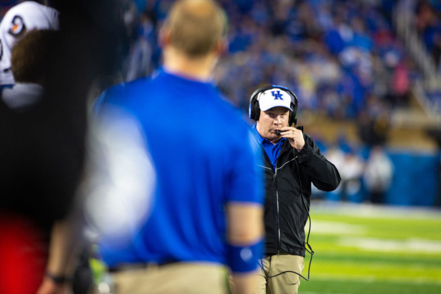 Kentucky Wildcats head coach Mark Stoops talks on his headset during the game against Mississippi State on Saturday, Sept. 22, 2018, in Lexington, Kentucky. Photo by Jordan Prather | Staff
