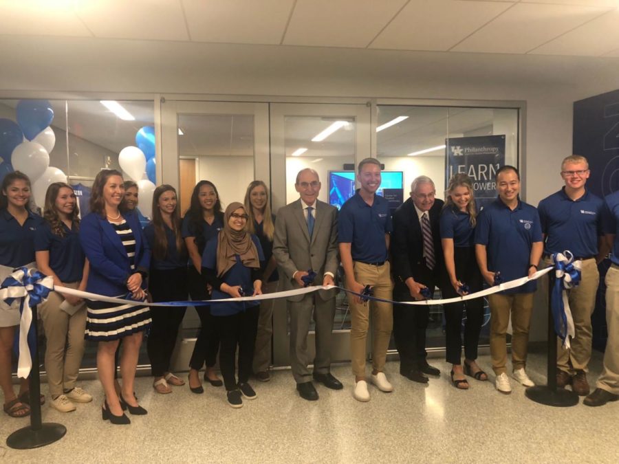 President Eli Capilouto and members of the Student Board of Philanthropy grin as they cut the ribbon on the new Center for Student Philanthropy in the Bill Gatton Student Center on Sept. 7, 2018. The office hopes to educate generations of students on the power of giving.