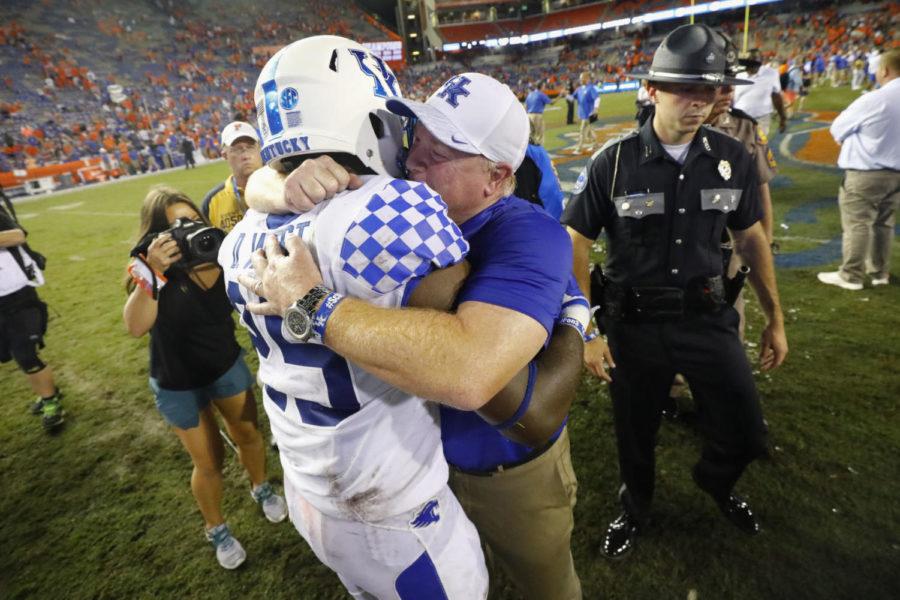 Kentucky+Wildcats+safety+Darius+West+%2825%29+celebrated+with+Kentucky+Wildcats+head+coach+Mark+Stoops+after+their+27-16+victory+over+the+Florida+Gators+Saturday+at+Ben+Hill+Griffin+Stadium+in+Gainesville.+Photo+provided+by+Alex+Slitz+%7C+Lexington+Herald-Leader